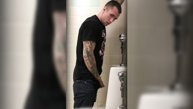 Tattooed Pisser with Nice Cock Notices his Voyeur Spying on Him.