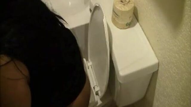 woman poops in toilet